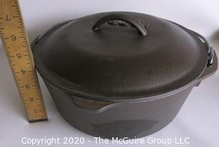 Lodge Heavy Cast Iron Pot with Lid and Handle.  New with Label inside. Measures approximately 5" x 11".