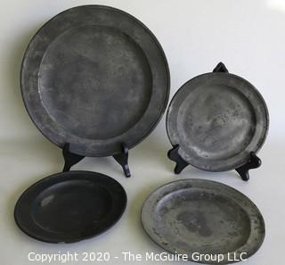 Four Antique Pewter Chargers; largest is 12" diameter; smallest is 8" diameter. 