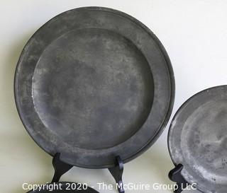 Four Antique Pewter Chargers; largest is 12" diameter; smallest is 8" diameter. 