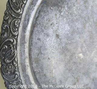 Round Pewter Tray with Floral Relief Edge.  Measures approximately 12".