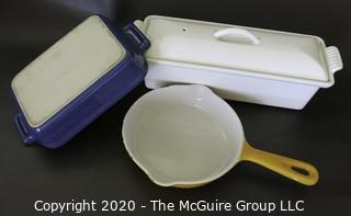 Three Pieces of Cast Iron Enamel Cookware made by Le Creuset  (White Rectangular Casserole & Blue Dish) and Cousances (Yellow Pan).