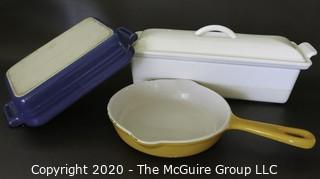 Three Pieces of Cast Iron Enamel Cookware made by Le Creuset  (White Rectangular Casserole & Blue Dish) and Cousances (Yellow Pan).