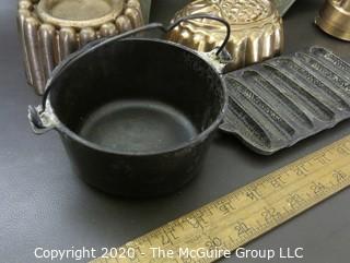 Group of Seven Baking Molds and Cast Iron Cooking Pieces. 