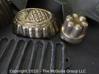 Group of Seven Baking Molds and Cast Iron Cooking Pieces. 