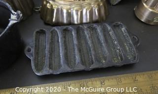 Group of Seven Baking Molds and Cast Iron Cooking Pieces. 