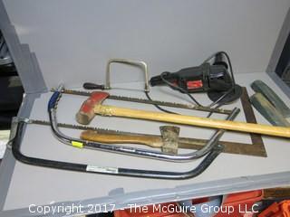 Collection of tools including Craftsman polisher/sander, axe and various saws