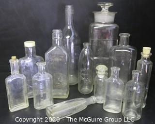 Large Grouping of Vintage Clear Glass Bottles. 