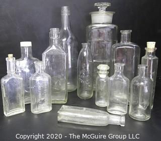 Large Grouping of Vintage Clear Glass Bottles. 