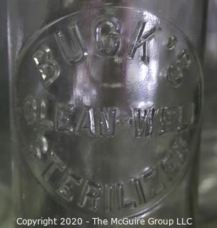 Large Grouping of Vintage Clear Glass Bottles. 