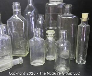 Large Grouping of Vintage Clear Glass Bottles. 