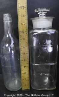 Large Grouping of Vintage Clear Glass Bottles. 