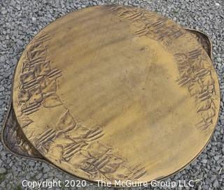 Persian Copper Tray Coffee Table with Cast Iron Stand.  Measures approximately 26" in diameter and 19" tall. 