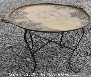 Persian Copper Tray Coffee Table with Cast Iron Stand.  Measures approximately 26" in diameter and 19" tall. 