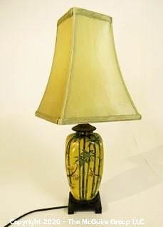 Small Yellow Asian Inspired Ceramic Table Lamp with Shade.  Measures approximately 25" tall not including harp. 