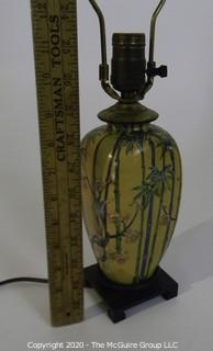 Small Yellow Asian Inspired Ceramic Table Lamp with Shade.  Measures approximately 25" tall not including harp. 