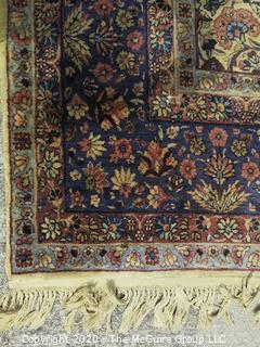 Kerman Persian Circa 1940 Hand Knotted Wool on Wool Rectangular Field with Flowers and Leaves on Beige Ground Surrounded by Five Border Guards.  Measures approximately 105" x 145".