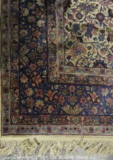 Kerman Persian Circa 1940 Hand Knotted Wool on Wool Rectangular Field with Flowers and Leaves on Beige Ground Surrounded by Five Border Guards.  Measures approximately 105" x 145".