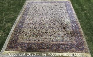 Kerman Persian Circa 1940 Hand Knotted Wool on Wool Rectangular Field with Flowers and Leaves on Beige Ground Surrounded by Five Border Guards.  Measures approximately 105" x 145".