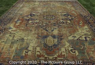 Hand Knotted Wool Rug with Blue Ground.  Poor condition with some holes and much wear.  Measures approximately 133" x 115"