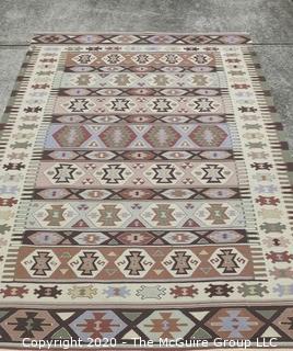 Hand Knotted Wool Kilim Rug with Geometric Pattern in Brown on Beige Ground.  Measures approximately 105" x 67".