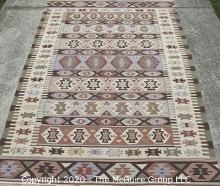 Hand Knotted Wool Kilim Rug with Geometric Pattern in Brown on Beige Ground.  Measures approximately 105" x 67".