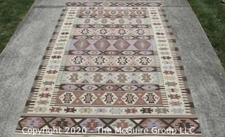 Hand Knotted Wool Kilim Rug with Geometric Pattern in Brown on Beige Ground.  Measures approximately 105" x 67".