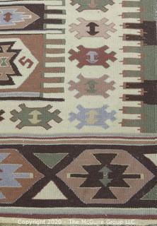 Hand Knotted Wool Kilim Rug with Geometric Pattern in Brown on Beige Ground.  Measures approximately 105" x 67".