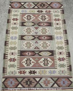 Small Hand Knotted Wool Kilim Rug with Geometric Pattern in Brown on Beige Ground. 