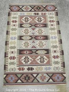 Small Hand Knotted Wool Kilim Rug with Geometric Pattern in Brown on Beige Ground. 