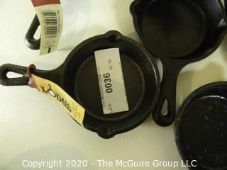 Two Large Fluted Bread Molds and Group of Lodge Mini Cast Iron Skillets, Many New with Original Tags.  