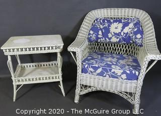 Antique White Painted Wicker Wing Back Armchair and Matching Side Table with Blue Cushions.  