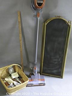 Collection including corded vacuum, Fireplace screen (24" x 52") and assorted paint brushes in basket