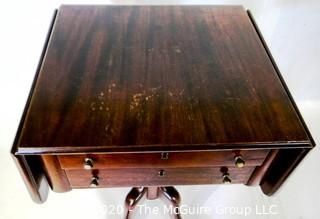 Pedestal drop leaf mahogany two drawer side table; 28"T x 34"W (with leaves up)