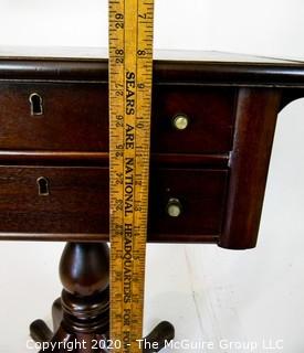 Pedestal drop leaf mahogany two drawer side table; 28"T x 34"W (with leaves up)