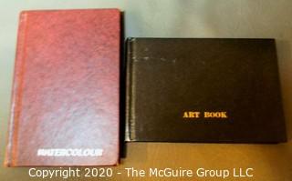 Two small sketch books with approx. _ watercolors 