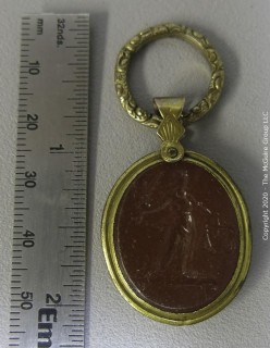 Italian 19th Century Hand Carved Cameo Set in Period Gold Filled Bezel with Rope Banding.  Image of Greek Woman with Garlands in her Hair.  Measures 2" x 1 1/8". 