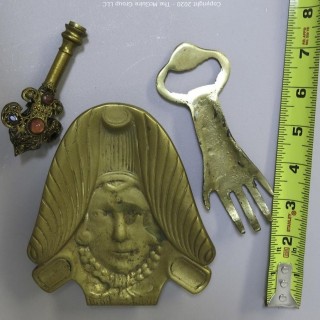 Three Brass Decorative Items Including Ashtray, Bottle Opener and Finale with Inlaid Stones.