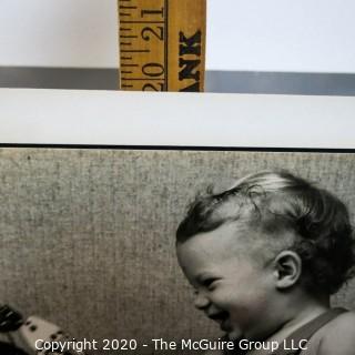 Black & White Photo - Child in High Chair by Sara Langston. Measures 16" x 20" and mounted on picture board.