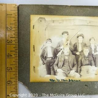 Black and White Sepia Tone Photograph Mounted on Board of Mr. & Mrs. Johnson Holding Photo.  Measures approximately 9" x 7".