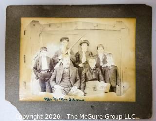 Black and White Sepia Tone Photograph Mounted on Board of Mr. & Mrs. Johnson Holding Photo.  Measures approximately 9" x 7".