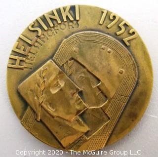 1952 Helsinki XV Summer Olympics Bronze Participation Medal. Designed by Kauko Rasanen and minted by Veljekset Sundqvist Oy in Helsinki it measures approximately 2 1/2 in diameter.