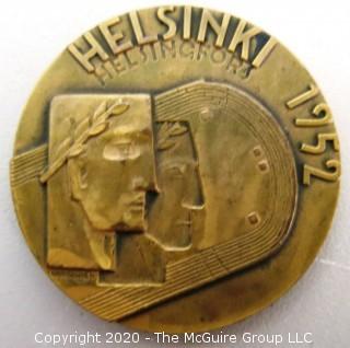 1952 Helsinki XV Summer Olympics Bronze Participation Medal. Designed by Kauko Rasanen and minted by Veljekset Sundqvist Oy in Helsinki it measures approximately 2 1/2 in diameter.