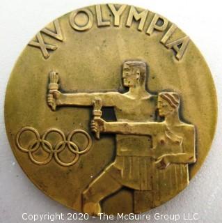 1952 Helsinki XV Summer Olympics Bronze Participation Medal. Designed by Kauko Rasanen and minted by Veljekset Sundqvist Oy in Helsinki it measures approximately 2 1/2 in diameter.