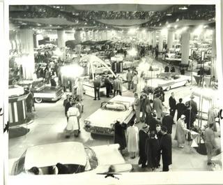 Set of Three Large Format Unframed Black & White Photographs from the Chicago Auto Show; by Joe Kordick, 1964. Measures approximately 14" x 9".
