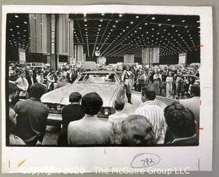 Large Format Unframed Black & White Photograph from the Chicago Auto Show by John White. Measures approximately 14" x 9".