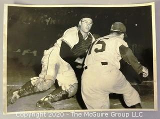 Black & White Photo of Impending Home Plate Collision.  Believed to be a Rickerby photo; who pioneered the use of 35mm film with telephoto lenses to capture sports action stills.  Measures approximately 8" x 10". 