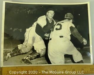 Black & White Photo of Impending Home Plate Collision.  Believed to be a Rickerby photo; who pioneered the use of 35mm film with telephoto lenses to capture sports action stills.  Measures approximately 8" x 10". 