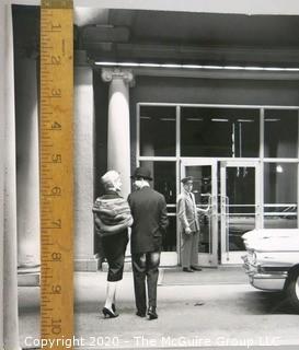 Large Format Black & White Photo of Couple walking into hotel.  Presumed Rickerby