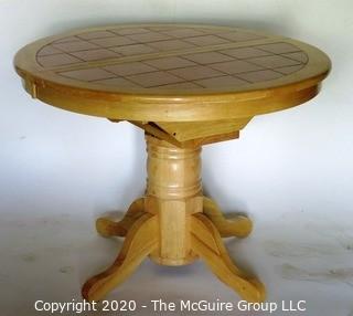 Round Pedestal Table with Terracotta Tile Top and Hidden Expandable Leaf Underneath.  