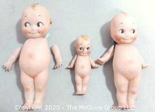 Three Porcelain or Bisque Kewpie Dolls with Frozen Standing Legs.